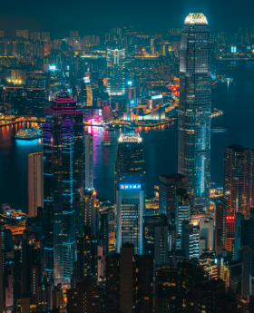 A luminous harbour skyline at night